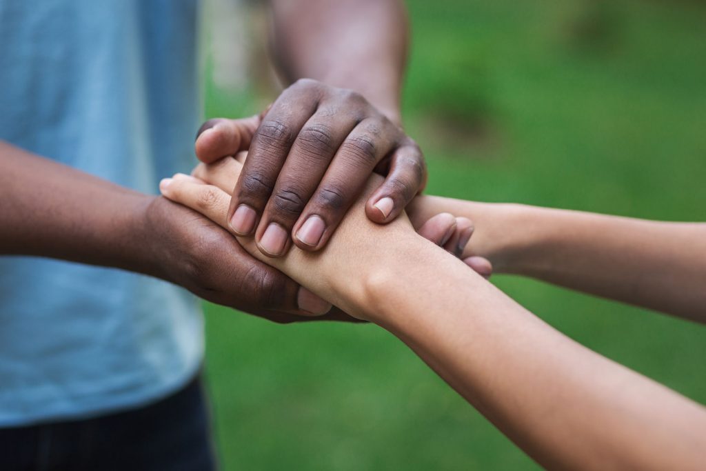 Guatemalan Volunteers holding hands