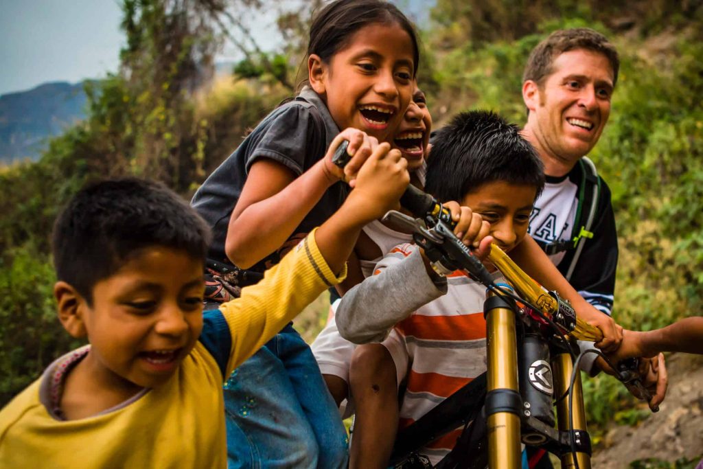 Kids in Guatemala with a volunteer