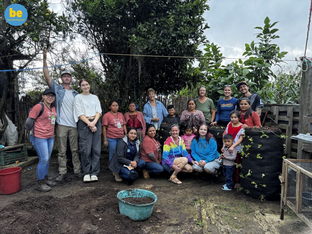Why choose an ethical volunteer vacation in Guatemala, a diverse group of volunteers and locals posing together outdoors