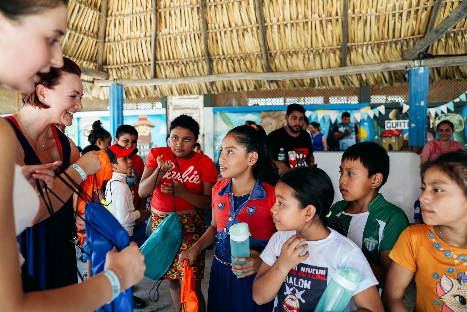 Volunteer with local children showing which Guatemala volunteer vacation is best community program 