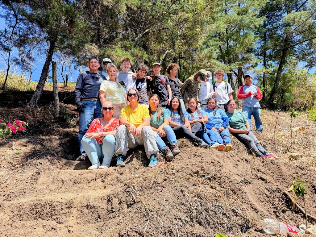 Volunteer group on a hillside project, an example of how to combine child sponsorship and travel Guatemala 