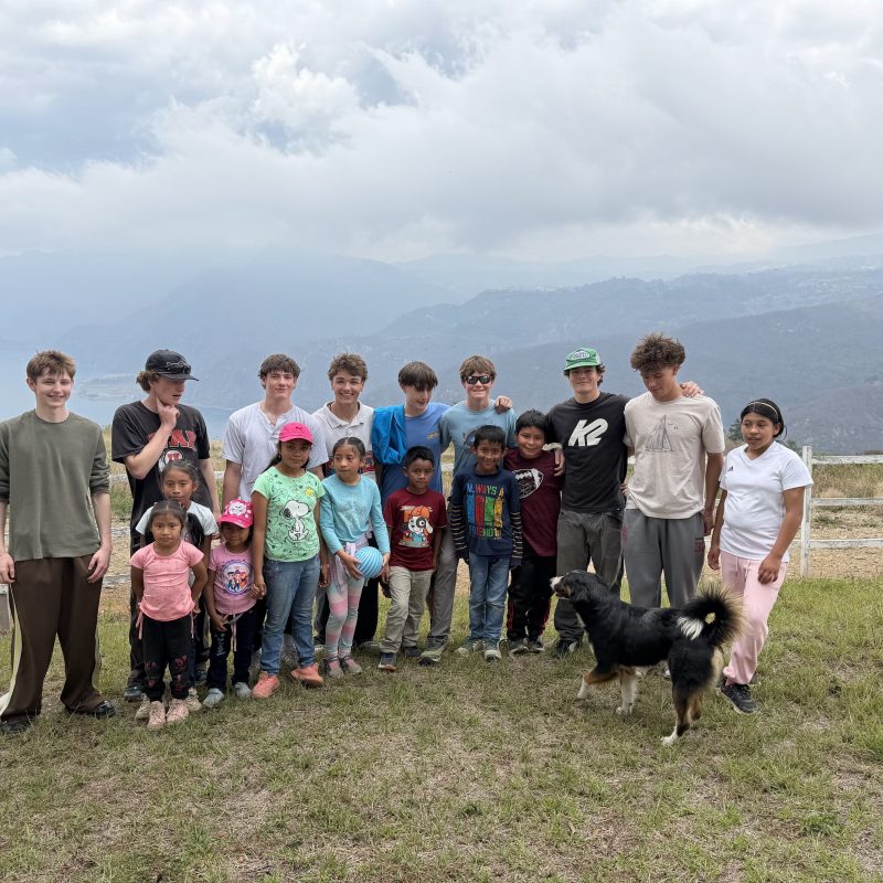 Volunteers and local kids together, an example of what to expect sponsoring child Guatemala visits