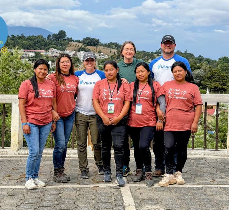 Volunteer team posing outdoors in Guatemala embodying the emotional benefits sponsoring child Guatemala