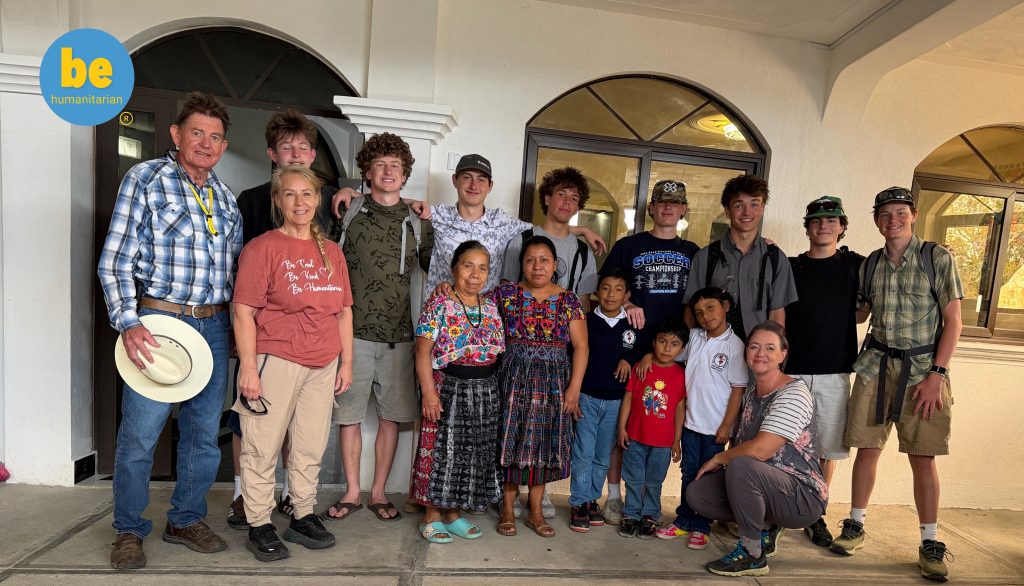 Group photo capturing what is Sustainable Guatemala volunteer impact with host family and volunteers