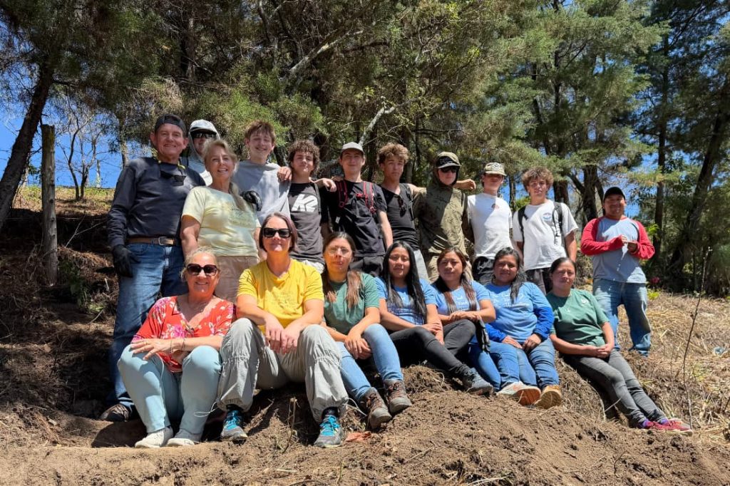 Corporate CSR retreat volunteer trip Guatemala unites volunteers and locals on wooded hillside