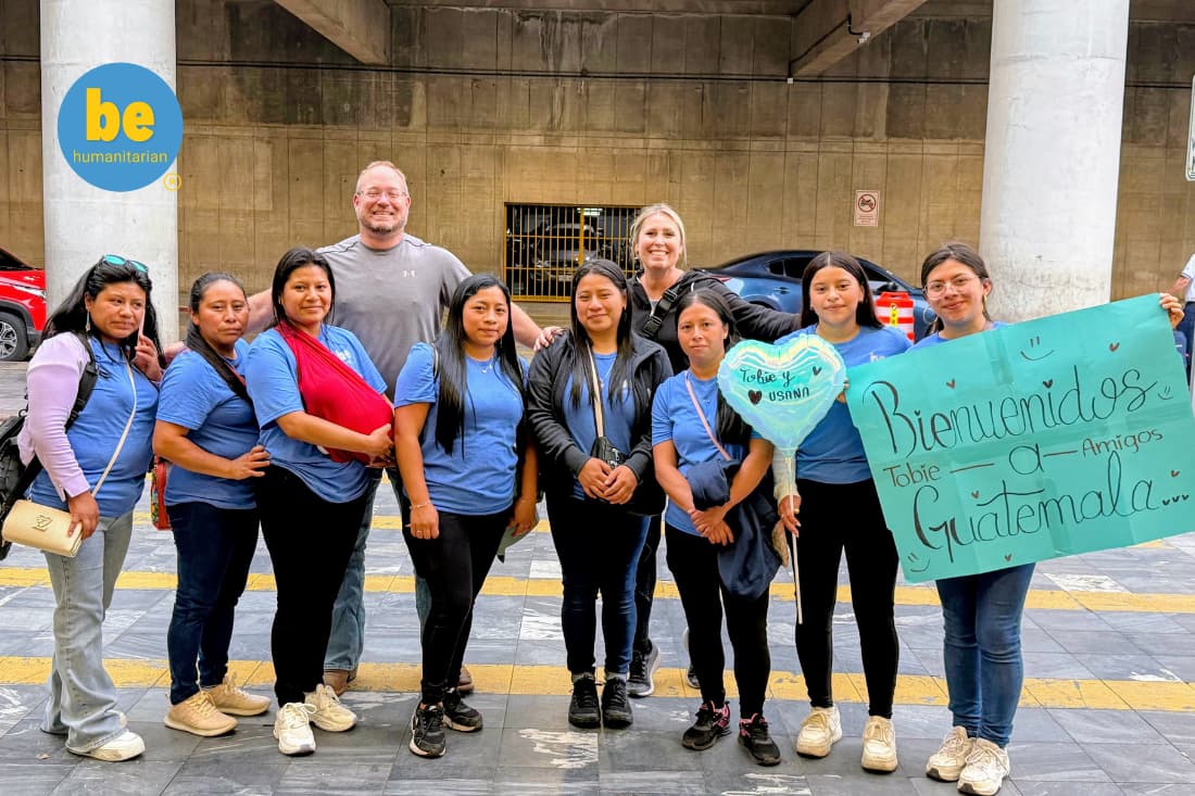 Corporate CSR retreat volunteer trip Guatemala welcomed with handmade sign and community greeting