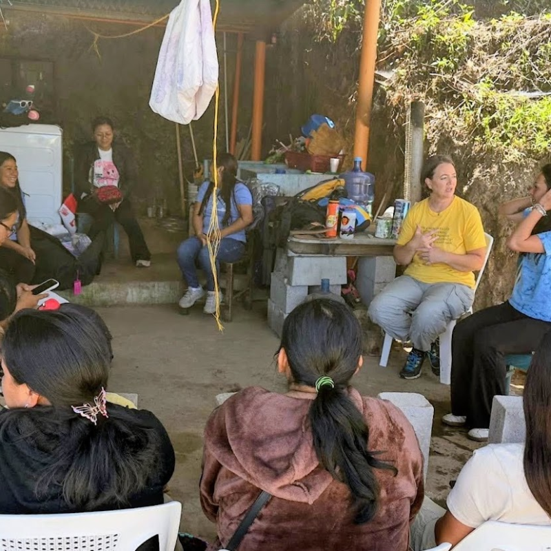Volunteers meet with women in rural Guatemala, showing how volunteer vacations impact rural Guatemala communities. 