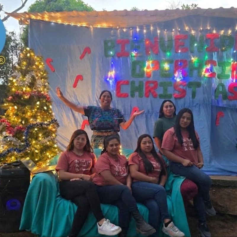 Volunteers and locals celebrate together, reflecting volunteer vacation impact in Guatemala communities.